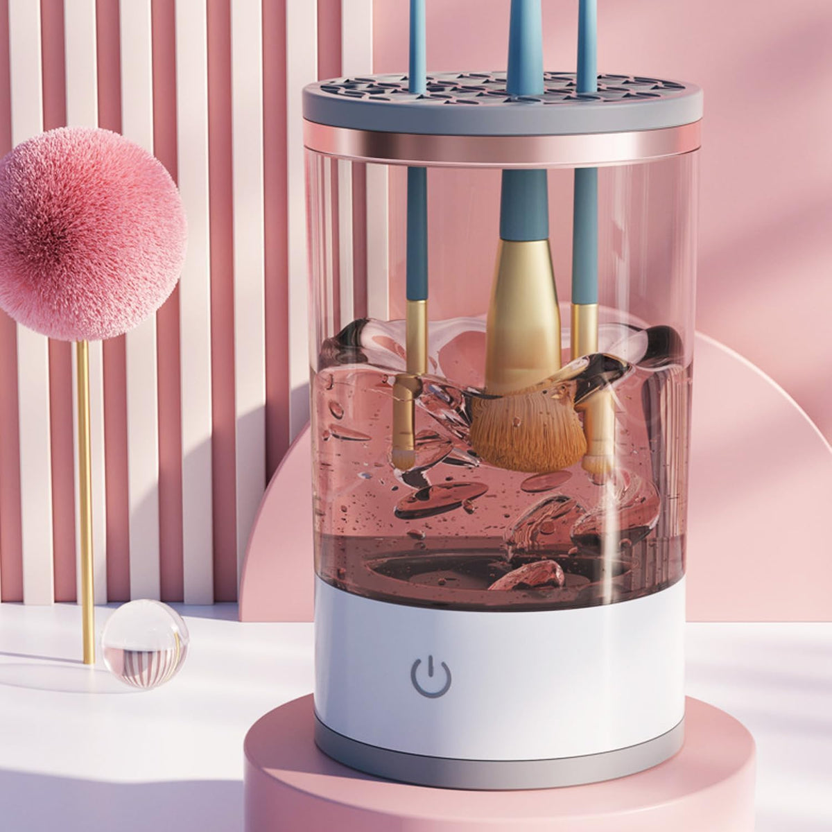 Limpiador eléctrico con brochas dentro del recipiente sobre un tocador rosa.