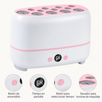 Secador de brochas blanco y rosa con detalles del botón de encendido, pantalla digital, temporizador y ranuras superiores.