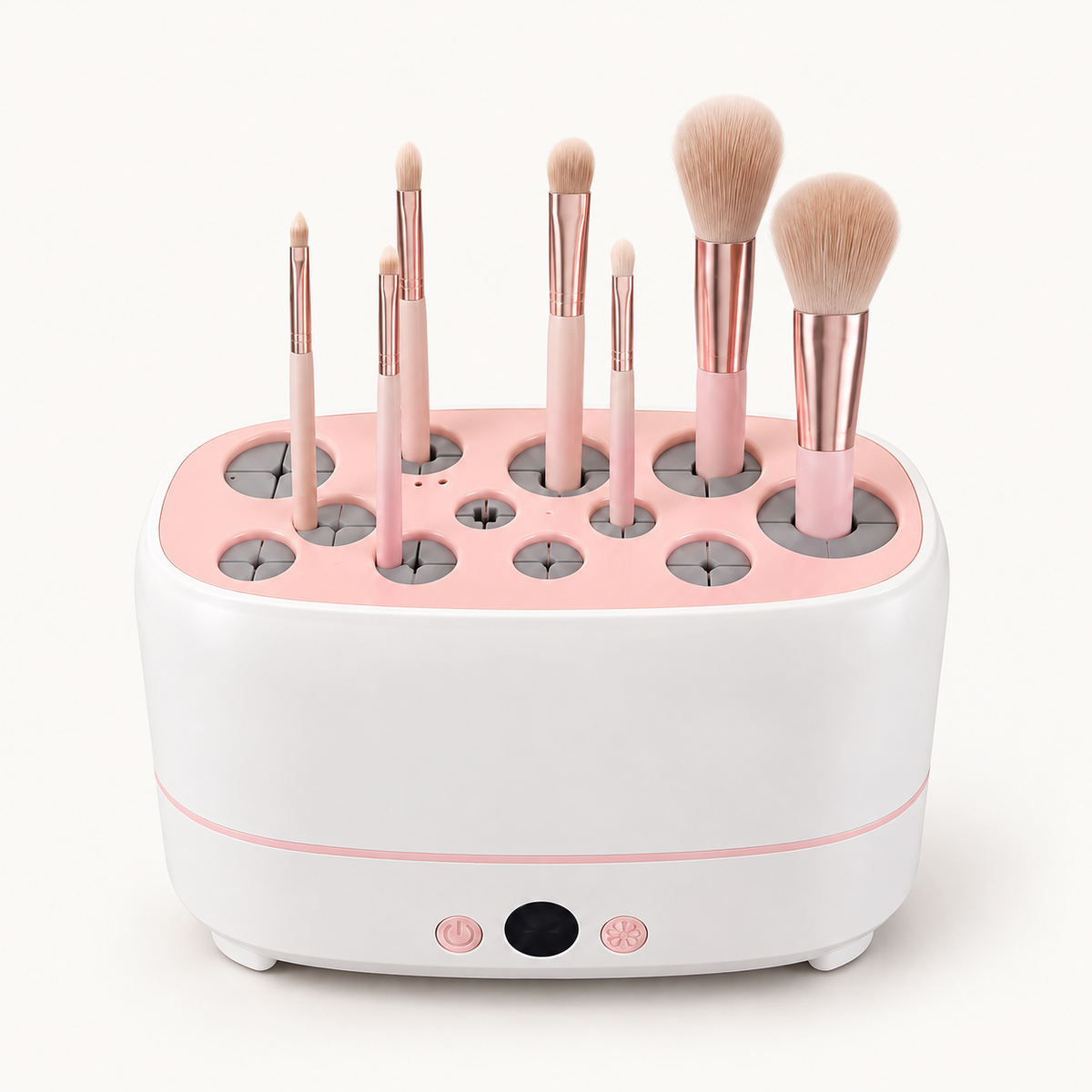 Secador y organizador de brochas de maquillaje blanco y rosa, con ranuras superiores y controles frontales